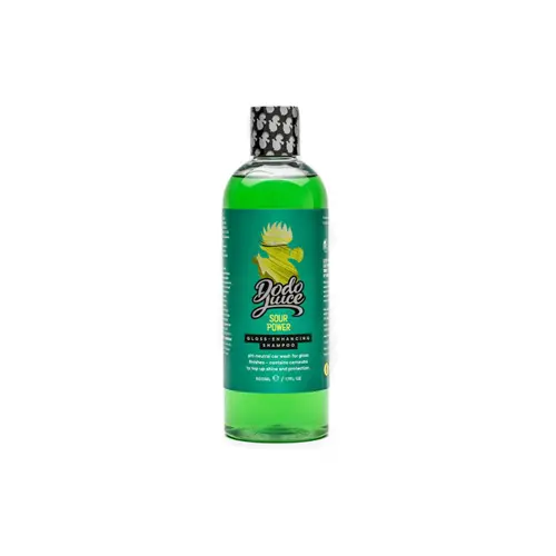 En grön flaska vaxschampo för bilar